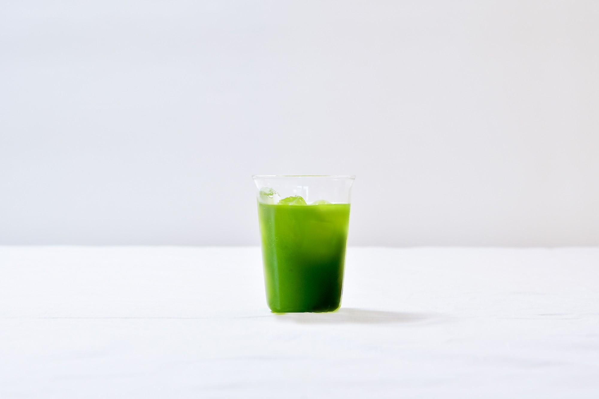 Vibrant iced green Kuwa Matcha drink on a clean white background